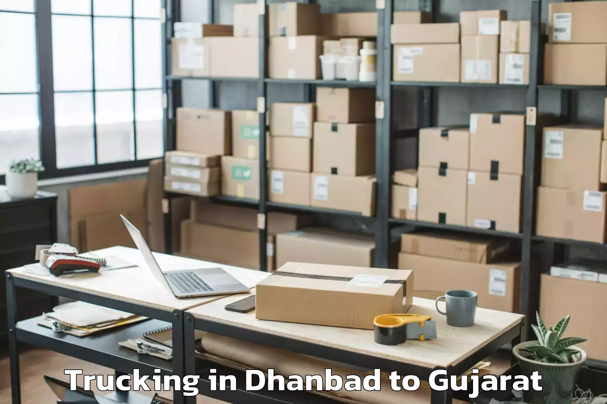 Easy Dhanbad to Modasa Trucking Booking